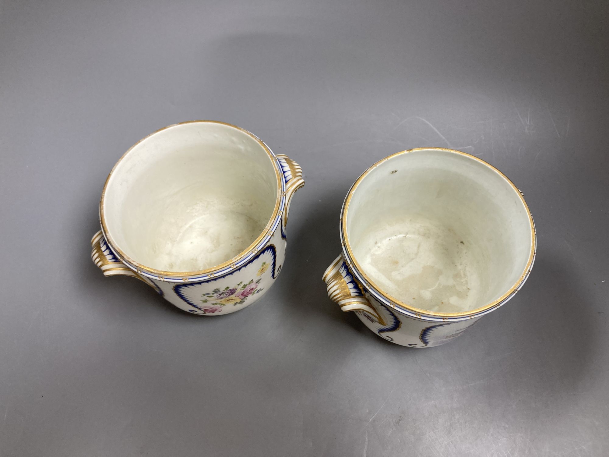 A pair of 19th century Sevres style porcelain half bottle wine coolers, 12cm high